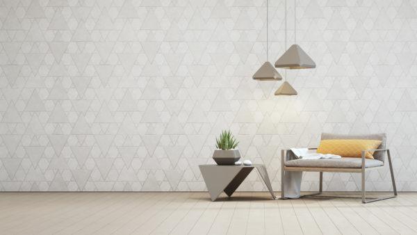 Indoor plant on steel coffee table and armchair with empty white triangle pattern wall background